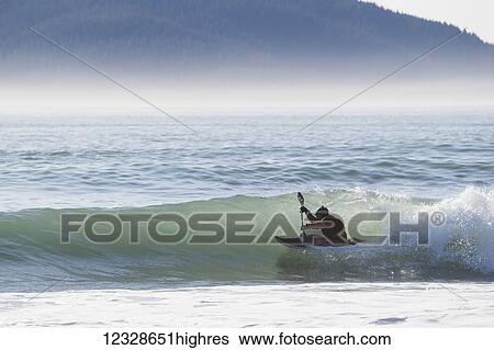 Person kayaking surfing along the Kenai Peninsula Outer Coast, South-central Alaska; Alaska, United States of America View Large Photo Image Stock Photograph - Person kayaking surfing along the Kenai Peninsula Outer Coast, South-central Alaska; Alaska, United States of America. Fotosearch