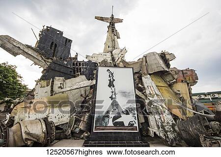 Stock Photograph - Picture of a female fighter in the aircraft wreckage sculpture on display at the Vietnam Military History Museum; Hanoi, Vietnam. Fotosearch