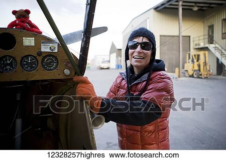 Stock Photograph - Pilot Next To A Piper J-3 Cub, Homer Airport, Southcentral Alaska, USA. Fotosearch