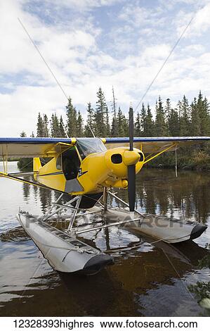 Stock Photograph - Piper J-3 Super Cub On Floats Beached On Lake Iliamna, Southwest Alaska, USA. Fotosearch