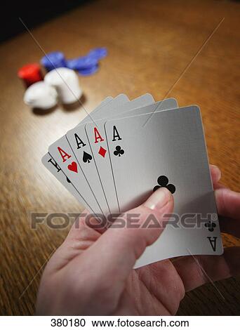 Stock Image - Playing with a poker hand. Fotosearch