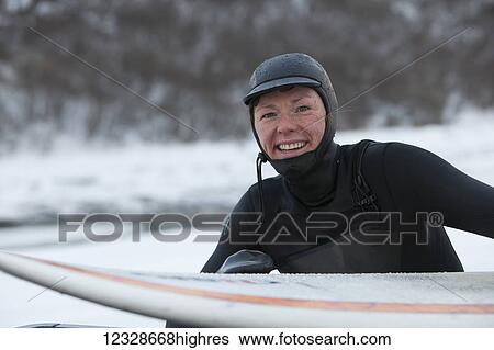 Portrait of a female surfer with surfboard, South-central Alaska; Homer, Alaska, United States of America View Large Photo Image Stock Photograph - Portrait of a female surfer with surfboard, South-central Alaska; Homer, Alaska, United States of America. Fotosearch