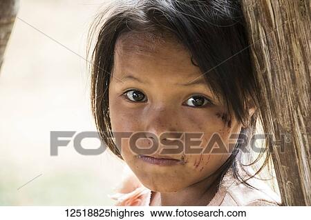 Portrait of a Hmong girl in Na Kam Peng, also called Bomb Village; Xiangkhouang, Laosa View Large Photo Image Stock Photograph - Portrait of a Hmong girl in Na Kam Peng, also called Bomb Village; Xiangkhouang, Laosa. Fotosearch