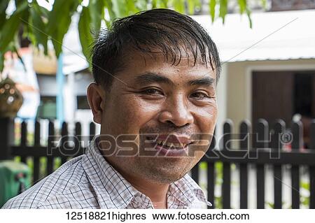 Stock Photograph - Portrait of a Lao man; Luang Prabang, Luang Prabang, Laos. Fotosearch