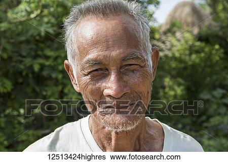 Stock Photograph - Portrait of a senior Cambodian man; O Sra Lav, Cambodia. Fotosearch