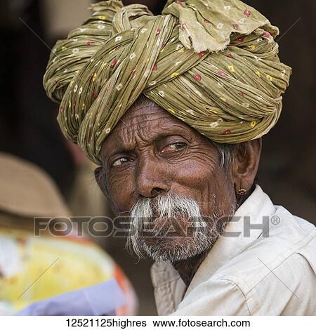Stock Photograph - Portrait of a senior Indian man in a turban, Jaisalmer Fort; Jaisalmer, Rajasthan, India. Fotosearch