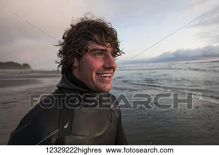 Portrait of a surfer along the coast near Yakutat, Southeast Alaska; Alaska, United States of America View Large Photo Image Stock Photograph - Portrait of a surfer along the coast near Yakutat, Southeast Alaska; Alaska, United States of America. Fotosearch