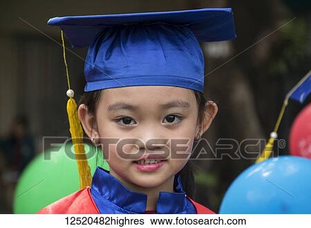 Portrait of a Vietnamese school girl in a cap and gown for graduation, Ho Chi Minh City, Vietnam View Large Photo Image Stock Photograph - Portrait of a Vietnamese school girl in a cap and gown for graduation, Ho Chi Minh City, Vietnam. Fotosearch