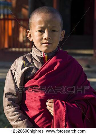 Stock Photograph - Portrait of a young buddhist monk; Sikkim, India. Fotosearch