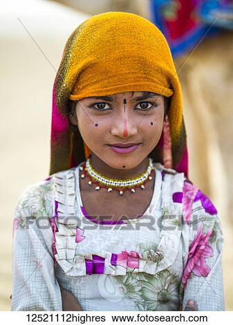 Portrait of a young Indian girl with markings on her face; Kanoi, Rajasthan, India View Large Photo Image Stock Photograph - Portrait of a young Indian girl with markings on her face; Kanoi, Rajasthan, India. Fotosearch