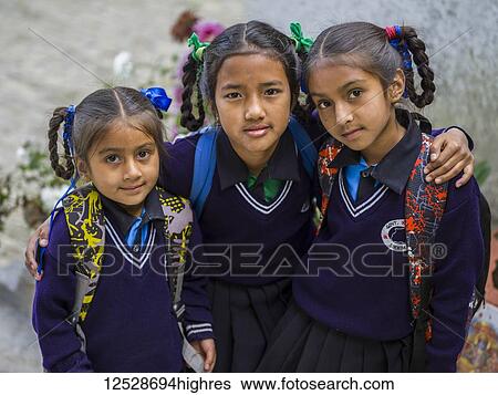 Portrait of three young girls in school uniforms; Bhalu Khop Village, Sikkim, India View Large Photo Image Stock Photograph - Portrait of three young girls in school uniforms; Bhalu Khop Village, Sikkim, India. Fotosearch