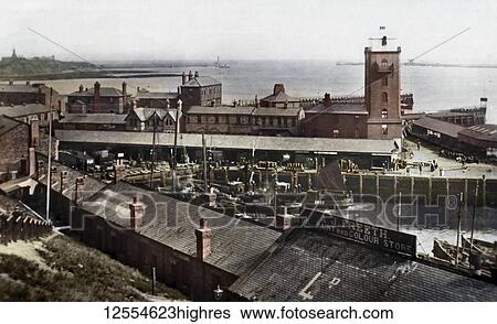 Postcard circa 1900, Victorian/Edwardian Social History. A view of North Shields Fish Quay with low light. Many fishing boats in harbour and the store A. J. Freeth looking out towards the North and South piers; North Shields, Tyne and Wear, England View Large Photo Image Stock Photograph - Postcard circa 1900, Victorian/Edwardian Social History. A view of North Shields Fish Quay with low light. Many fishing boats in harbour and the store A. J. Freeth looking out towards the North and South piers; North Shields, Tyne and Wear, England. Fotosearch