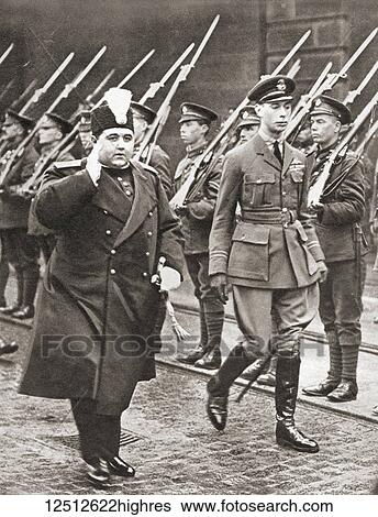 Stock Photograph - Prince Albert, right with the Shah of Persia, London, England, 1919. Prince Albert, future George VI, 1895 1952. King of the United Kingdom and the Dominions of the British Commonwealth. Ahmad Sh? h Q? j? r, 1898 1930. Shah of Persia and the last.... Fotosearch