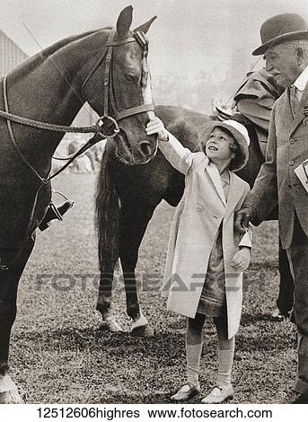 Stock Photograph - Princess Elizabeth at the Richmond Horse Show in 1934. Princess Elizabeth of York, future Elizabeth II, born 1926. Queen of the United Kingdom. From The Coronation Book of King George VI and Queen Elizabeth, published 1937.. Fotosearch