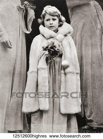 Stock Photograph - Princess Elizabeth of York, seen here as a bridesmaid at the wedding of Lady May Cambridge in 1931. Princess Elizabeth of York, future Elizabeth II, born 1926. Queen of the United Kingdom. From The Coronation Book of King George VI and Queen.... Fotosearch