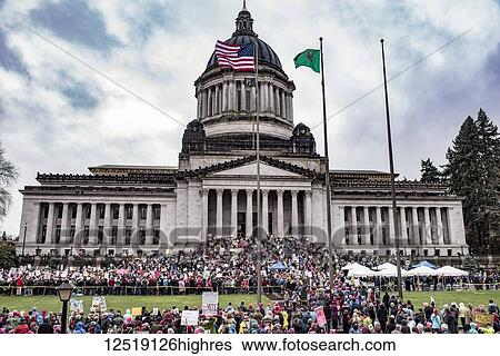 Stock Photograph - Protesters at the 2018 Women's Day March in Olympia at the Washington State Capitol; Olympia, Washington, United States of America. Fotosearch
