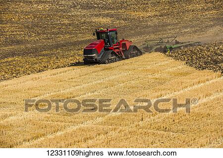 Quadtrac Tractor Discing A Field Of Wheat Stubble In The Palouse Region Of Eastern Washington; Washington, United States Of America View Large Photo Image Stock Photograph - Quadtrac Tractor Discing A Field Of Wheat Stubble In The Palouse Region Of Eastern Washington; Washington, United States Of America. Fotosearch