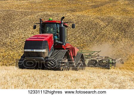 Quadtrac Tractor Discing A Field Of Wheat Stubble In The Palouse Region Of Eastern Washington; Washington, United States Of America View Large Photo Image Stock Photograph - Quadtrac Tractor Discing A Field Of Wheat Stubble In The Palouse Region Of Eastern Washington; Washington, United States Of America. Fotosearch