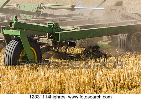 Stock Photograph - Quadtrac Tractor Discing A Field Of Wheat Stubble In The Palouse Region Of Eastern Washington; Washington, United States Of America. Fotosearch