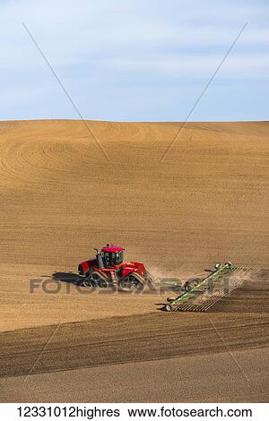 Quadtrac Tractor Harrowing A Garbanzo Bean Seedbed In The Palouse Region Of Eastern Washington; Washington, United States Of America View Large Photo Image Stock Photograph - Quadtrac Tractor Harrowing A Garbanzo Bean Seedbed In The Palouse Region Of Eastern Washington; Washington, United States Of America. Fotosearch
