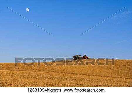 Quadtrac Tractor Pulling A Grain Cart In A Wheat Field During Harvest In The Palouse Region Of Eastern Washington; Washington, United States Of America View Large Photo Image Stock Photograph - Quadtrac Tractor Pulling A Grain Cart In A Wheat Field During Harvest In The Palouse Region Of Eastern Washington; Washington, United States Of America. Fotosearch