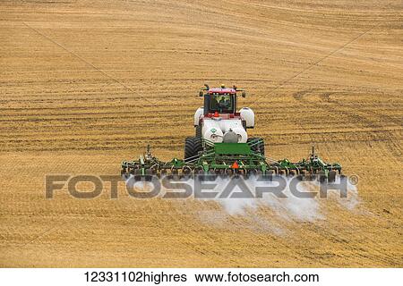 Quadtrac Tractor Pulling An Anhydrous Ammonia Tank And Applicator Applying The Anhydrous To A Field In Advance Of Preparing It For Planting In The Palouse Region Of Eastern Washington; Washington, United States Of America View Large Photo Image Stock Photograph - Quadtrac Tractor Pulling An Anhydrous Ammonia Tank And Applicator Applying The Anhydrous To A Field In Advance Of Preparing It For Planting In The Palouse Region Of Eastern Washington; Washington, United States Of America. Fotosearch