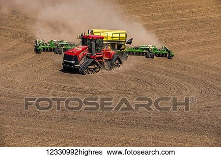 Stock Photograph - Quadtrac Tractor Seeding Garbanzo Beans In The Palouse Region Of Eastern Washington; Washington, United States Of America. Fotosearch