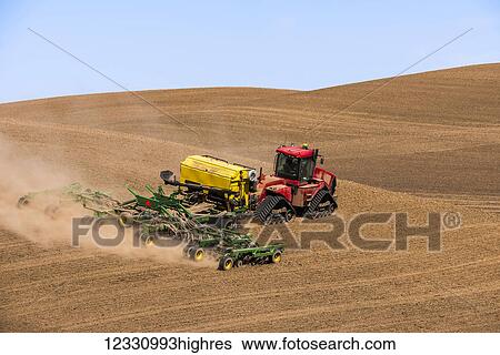 Stock Photograph - Quadtrac Tractor Seeding Garbanzo Beans In The Palouse Region Of Eastern Washington; Washington, United States Of America. Fotosearch