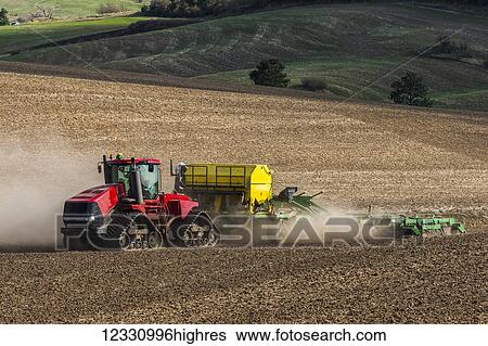 Stock Photograph - Quadtrac Tractor Seeding Garbanzo Beans In The Palouse Region Of Eastern Washington; Washington, United States Of America. Fotosearch