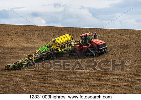 Stock Photograph - Quadtrac Tractor Seeding Garbanzo Beans In The Palouse Region Of Eastern Washington; Washington, United States Of America. Fotosearch