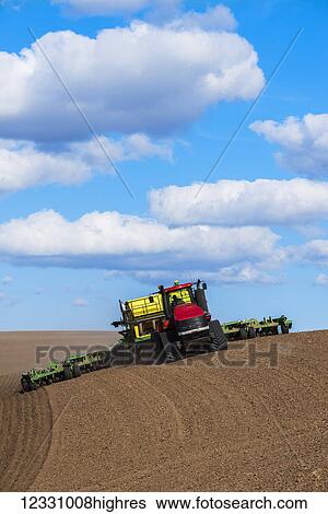 Stock Photograph - Quadtrac Tractor Seeding Garbanzo Beans In The Palouse Region Of Eastern Washington; Washington, United States Of America. Fotosearch