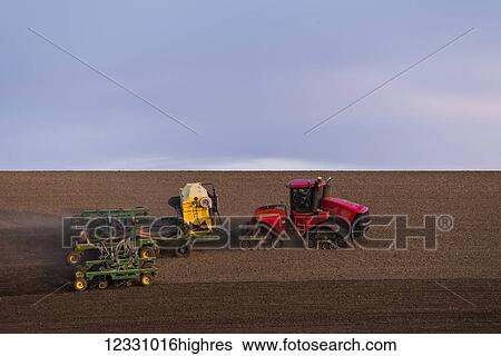 Stock Photograph - Quadtrac Tractor Seeding Garbanzo Beans In The Palouse Region Of Eastern Washington; Washington, United States Of America. Fotosearch