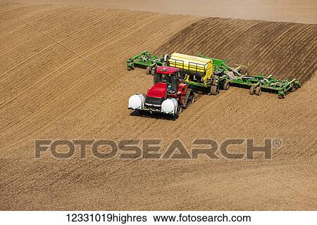 Stock Photograph - Quadtrac Tractor Seeding Garbanzo Beans In The Palouse Region Of Eastern Washington; Washington, United States Of America. Fotosearch