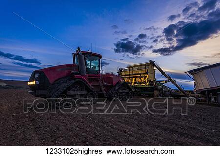 Quadtrac Tractor Seeding Garbanzo Beans At Sunset In The Palouse Region Of Eastern Washington; Washington, United States Of America View Large Photo Image Stock Photograph - Quadtrac Tractor Seeding Garbanzo Beans At Sunset In The Palouse Region Of Eastern Washington; Washington, United States Of America. Fotosearch