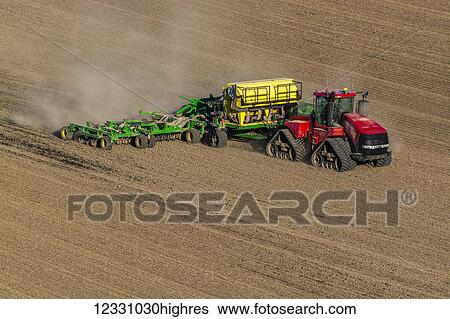 Stock Photograph - Quadtrac Tractor Seeding Garbanzo Beans In The Palouse Region Of Eastern Washington; Washington, United States Of America. Fotosearch