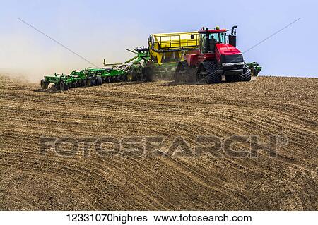 Stock Photograph - Quadtrac Tractor Seeding Garbanzo Beans In The Palouse Region Of Eastern Washington; Washington, United States Of America. Fotosearch