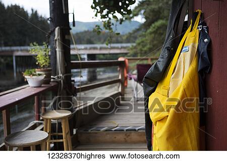 Stock Photograph - Rain Gear Hanging On The Deck In Seldovia, Alaska.. Fotosearch