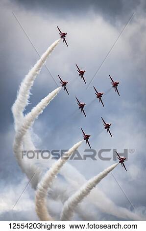 Stock Photograph - Red Arrows air display, nine planes flying in diamond nine formation, their trademark formation; South Shields, Tyne and Wear, England. Fotosearch