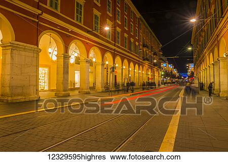 Red Light Trail Of Train Lights Down A Street; Nice, Cote D'azur, France View Large Photo Image Stock Photograph - Red Light Trail Of Train Lights Down A Street; Nice, Cote D'azur, France. Fotosearch