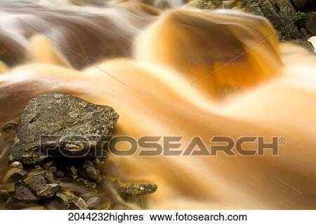 Stock Photograph - Rocks And And Rushing Waters Of Carding Mill Brook After Heavy Summer Rains, Country Harbour Wilderness, Nova Scotia. Fotosearch