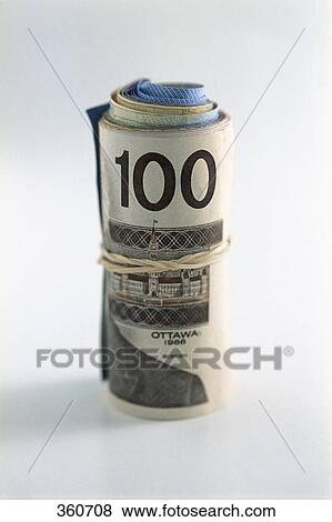 Stock Photo - Roll of money with a hundred on outside. Fotosearch
