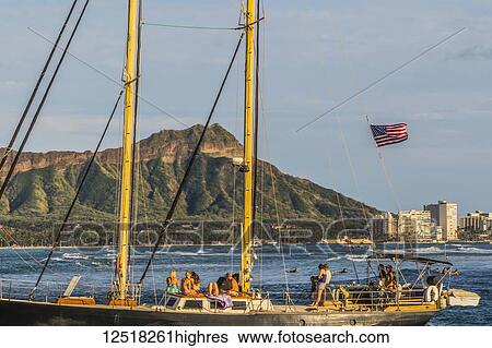 Stock Photograph - Sailing towards the Ala Wai boat harbor past Waikiki and Diamond Head; Honolulu, Oahu, Hawaii, United States of America. Fotosearch