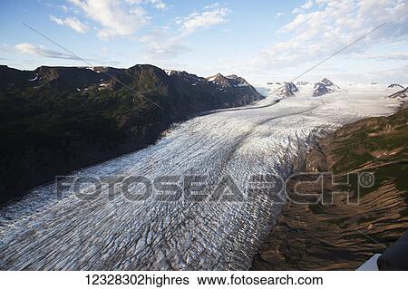 Scenic Aerial View Of Growing Glacier And The Kenai Mountains, Kachemak Bay State Park, Southcentral Alaska, USA View Large Photo Image Stock Photograph - Scenic Aerial View Of Growing Glacier And The Kenai Mountains, Kachemak Bay State Park, Southcentral Alaska, USA. Fotosearch
