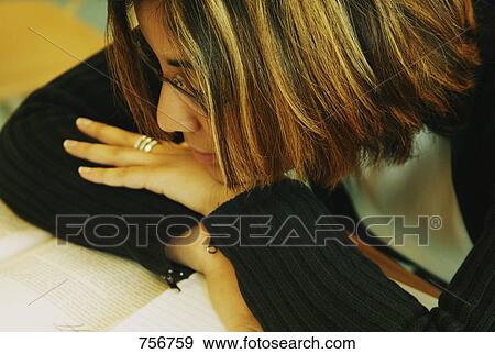 Stock Photo - Schoolgirl in class. Fotosearch
