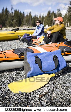 Sea kayakers hanging out on the beach next to boats, Kachemak Bay, South-central Alaska; Alaska, United States of America View Large Photo Image Stock Photograph - Sea kayakers hanging out on the beach next to boats, Kachemak Bay, South-central Alaska; Alaska, United States of America. Fotosearch