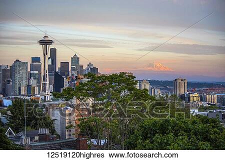 Stock Photograph - Seattle and Mount Rainier in late Summer Alpenglow; Seattle, Washington, United States of America. Fotosearch