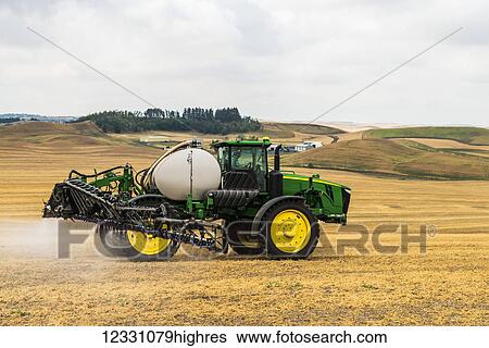 Stock Photograph - Self-Propelled Sprayer Spraying Herbicide On A Field In Advance Of Preparing It To Plant In The Palouse Region Of Eastern Washington; Washington, United States Of America. Fotosearch