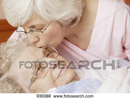Stock Photo - Senior gets a kiss. Fotosearch