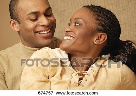 Sharing a laugh View Large Photo Image Stock Photo - Sharing a laugh. Fotosearch