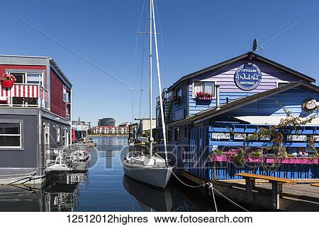 Stock Photograph - Shops and homes in Fisherman's Wharf in the Inner Harbour of Victoria, Vancouver Island; Victoria, British Columbia, Canada. Fotosearch